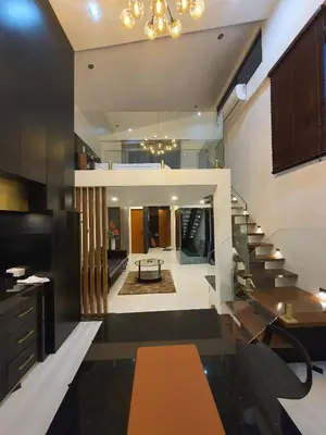 a living room with a staircase in a house at Casa Prinza Luxury Suite in Teresa