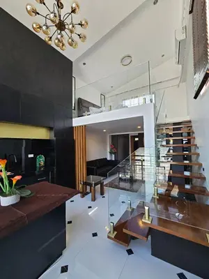 a living room with a glass staircase in a house at Casa Prinza Luxury Suite in Teresa