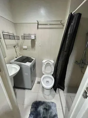 a bathroom with a toilet and a sink at 1br big cut 1524D Window Edsa Moa 2beds Queen size 1pullout 1extra mattress in Manila