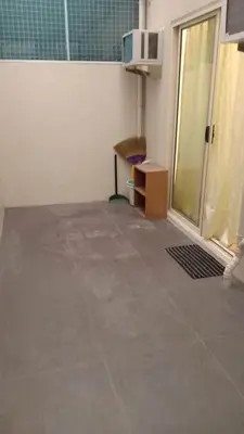 a room with a tile floor and a microwave at Your Home Away from Home in Manila