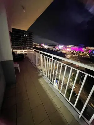 a view of a balcony of a building at night at 1058-3br-10 beds 1 extra mattress-moa view with balcony in Manila