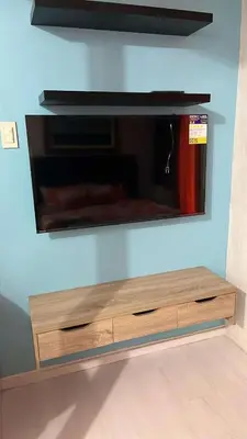 a flat screen tv hanging on a wall at 1 bedroom azure beachview 6 in Manila