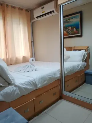 a mirror reflection of a bed in an rv at 101-2Br-1bed quenn-1single-1-pullout 2 sofa 2-cr pool view with balcony in Manila