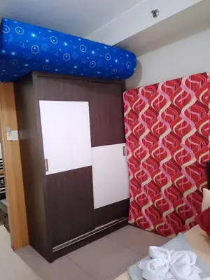 a room with a door and a red and white wall at 349-1br 1bed quenn 1sofa bed 2extra mattress moa view with balcony in Manila