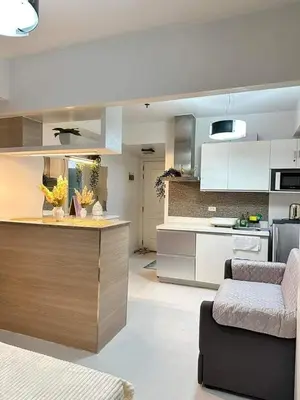 a kitchen with a counter top in a room at SM Bicutan MNL in Manila
