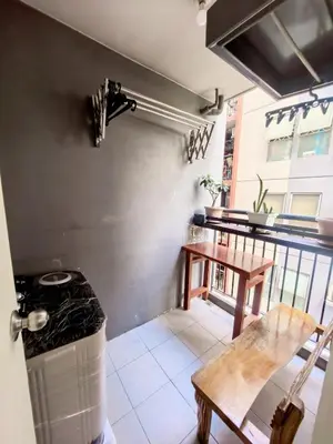 a balcony with a bench and a table and a counter at Ysabella's Abode in Manila
