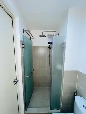 a bathroom with a shower and a toilet at SolAzur Staycation SMDC South Residences Las Piñas with 100MBPS Wifi &NETFLIX &BAR STATION &CITY LIGHTS VIEW in Manila
