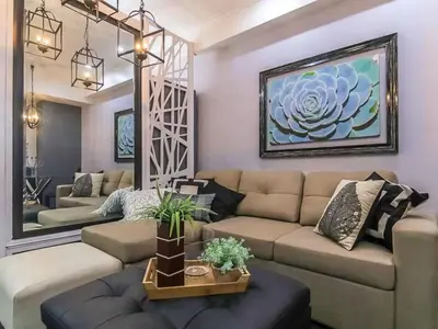 a living room with a couch and a table at BGC Urban Studio Prime Spot, Walk to Everything in Manila