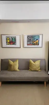 a couch with two pillows in a living room at The Venice Luxury Residences Condominium 28B Bellini, McKinley Hill, Taguig City, Philippines in Manila