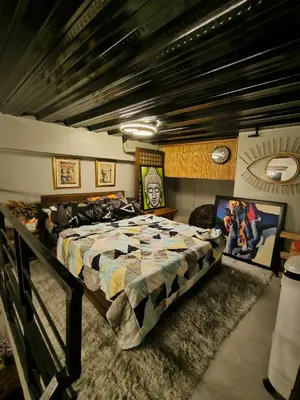 a bedroom with a large bed in a room at Unit 820 Zamora sky tower in Manila