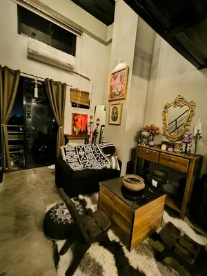 a living room with a couch and a table at Unit 820 Zamora sky tower in Manila