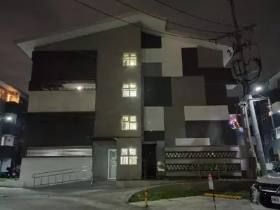 a building at night with its lights on at Tanza Cavite Staycation Condo Loft in Tanza