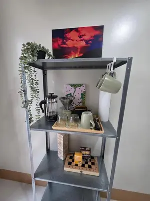 a shelf with food and other items on it at Aloha Escape for Coffee Lovers in Manila