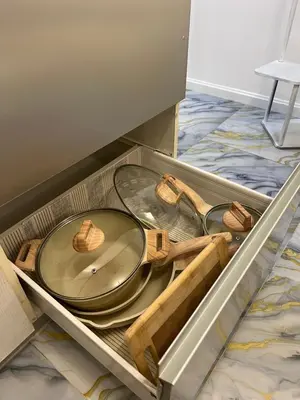 a drawer with a plate and a table in it at AZURE STAYCATION by TALA in Manila