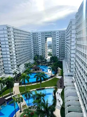 an aerial view of a resort with two pools at Mall of Asia Staycation in Manila