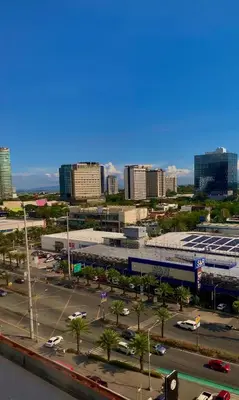 a view of a city with a parking lot and buildings at Amari Staycation - Alabang in Manila
