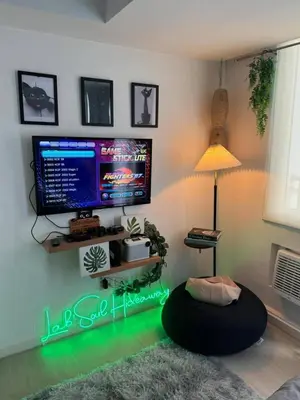 a living room with a tv and a bean bag chair at SM Bicutan Azure Flat in Manila