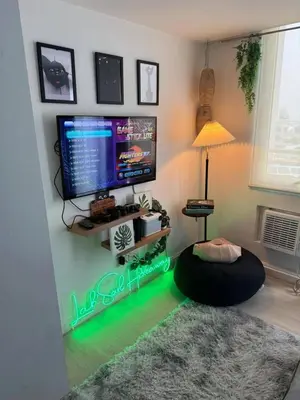 a living room with a tv and a ottoman at SM Bicutan Azure Flat in Manila