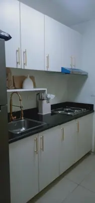 a kitchen with a sink and a counter top at 2 Bedroom Unit at Central Makati in Manila