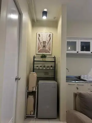 a kitchen with a washer and dryer in a room at Casa En El Sur in Santa Rosa