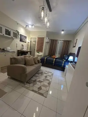 a living room with a couch and a bed at Casa En El Sur in Santa Rosa