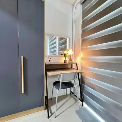 a home office with a desk and a chair at OASIS by JK Suites in Manila