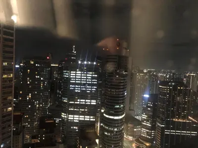 a view of a city skyline at night at Corner 1Bedroom with Unparalleled Views #5235 in Manila