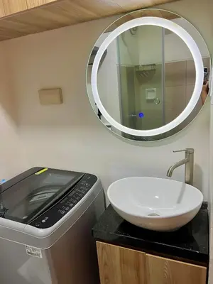 a bathroom with a sink and a mirror on the wall at dream horizon staycation in Manila