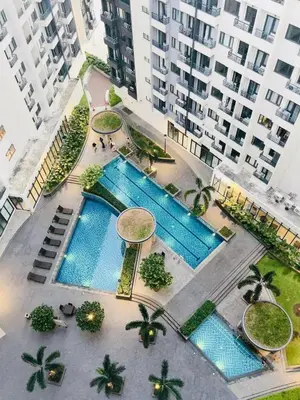 an overhead view of a pool in a city with buildings at dream horizon staycation in Manila