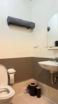a bathroom with a toilet and a sink at 2243 Taguig Condo Near Airport and BGC in Manila