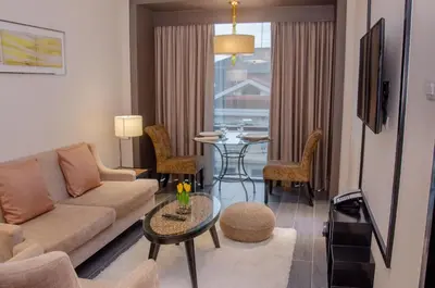 a living room with a couch and a table at Newport Stay by Runway Manila & Attractions in Manila