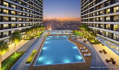 an aerial view of a building with a swimming pool at 1BR Condotel with Balcony at FAME Residences #FM62-1 in Manila