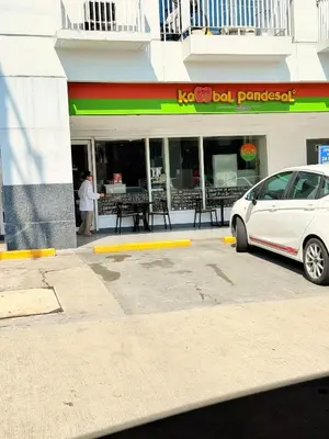 a white car parked in front of a restaurant at Sea Residences Manila Condotel by Paul in Manila