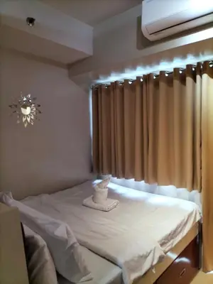 a room with a hospital bed with a window at Shell Residences MOA - JOSH in Manila