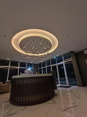 a large lobby with a large chandelier in a building at Pet Friendly Staycation at Pasig City in Manila