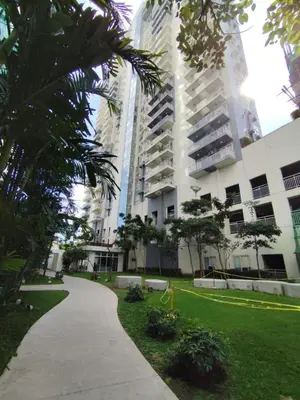 a walkway in front of a tall building at Pet Friendly Staycation at Pasig City in Manila