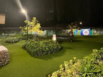 a park at night with green plants and a bench at 86 sqm, 3BR condo, Free Prking, WiFi, ntflx in Manila
