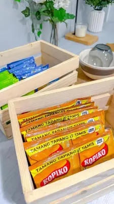 two wooden boxes filled with toothbrushes on a table at Azure Staycation in Manila
