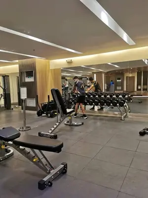 a group of people in a gym with machines at Mall of Asia condotel residence shore 3 in Manila