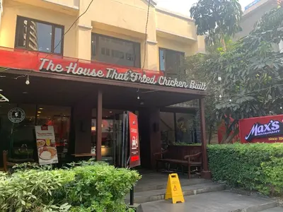 a building with a sign that reads the house that special chicken built at Avant at the Fort King bed Central 5mins to Highstreet BGC in Manila