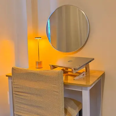 a desk with a laptop and a mirror on a wall at Shore Residences Haru Cozy pad Near Mall of Asia and Airport in Manila