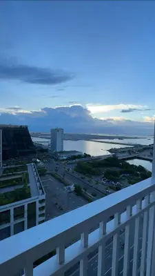 a view of a city and a body of water at Shore Residences Haru Cozy pad Near Mall of Asia and Airport in Manila