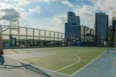 a tennis court on top of a city at QuiHouse in Manila