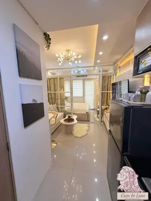 a room with a kitchen and a living room at Mall of Asia Casa de Lune at Shore 2 in Manila