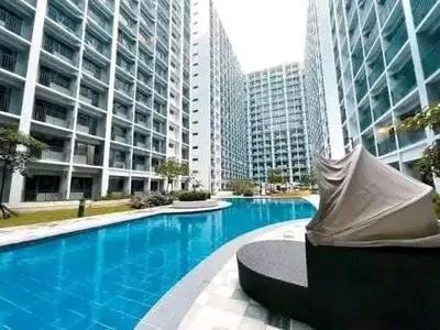 a swimming pool in a city with tall buildings at Mall of Asia Casa de Lune at Shore 2 in Manila