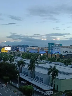 a view of a city with a parking lot at Shore moa view in Manila