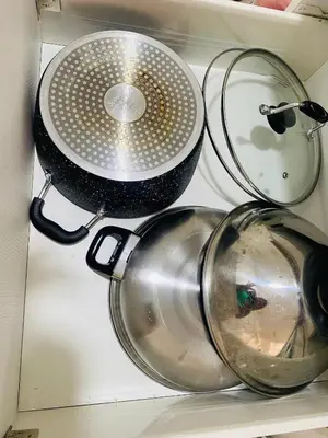 a colander and a strainer in a drawer at SM Bicutan Condo by Santorini in Manila