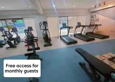 a gym with several exercise bikes on a counter at 1123 Field Res Condo by Bambie free drinking water in Manila