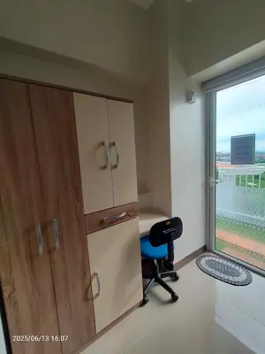 a room with a desk and a chair next to a window at 1123 Field Res Condo by Bambie free drinking water in Manila