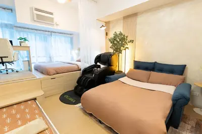 a room with a bed and a chair in it at 2mins to Malls, Unli Full Body Massage, Eastwood Le Grand 3 in Manila